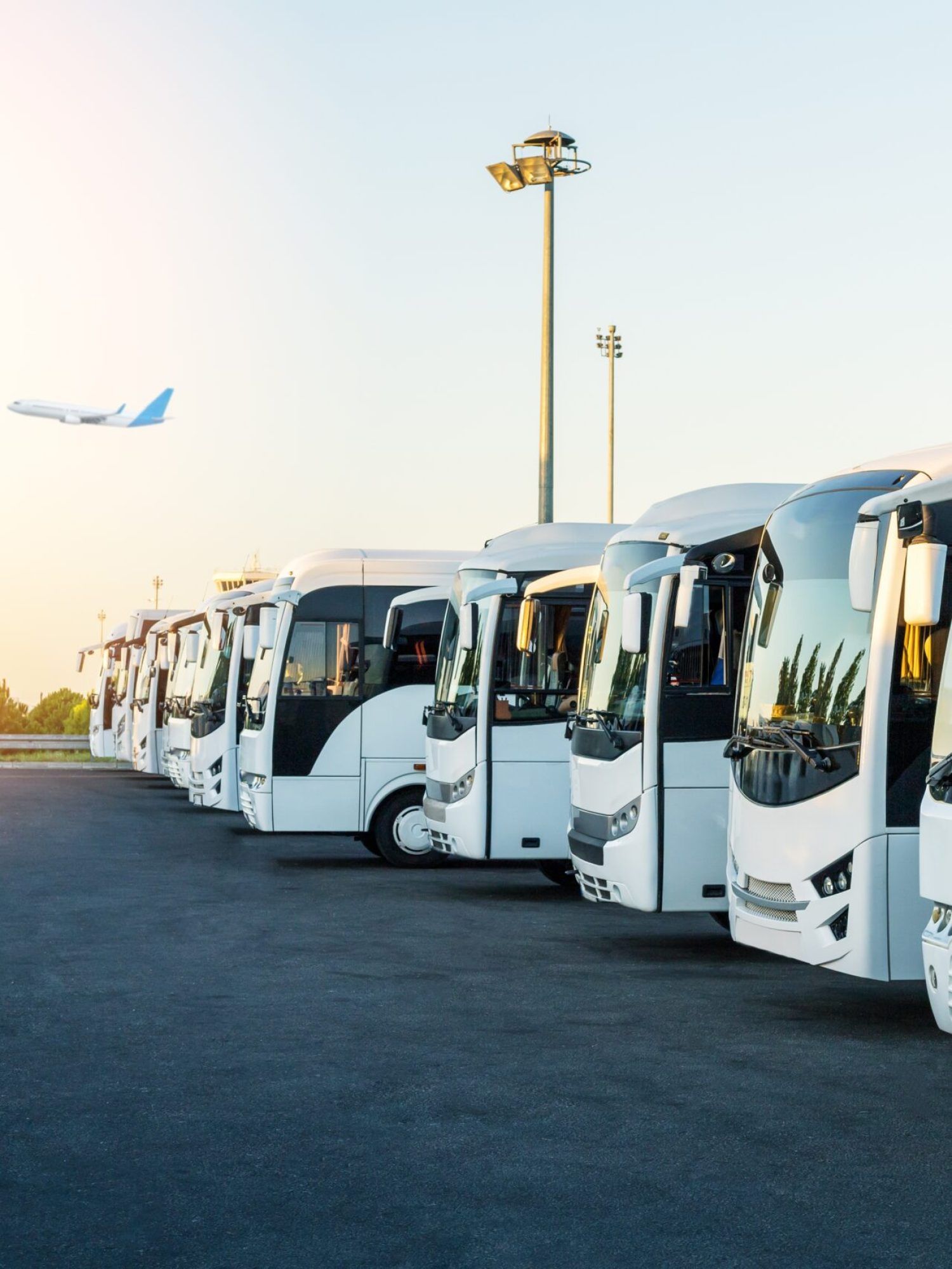 Buses,At,The,Parking,Lot,Of,The,Airport,At,Sunrise.